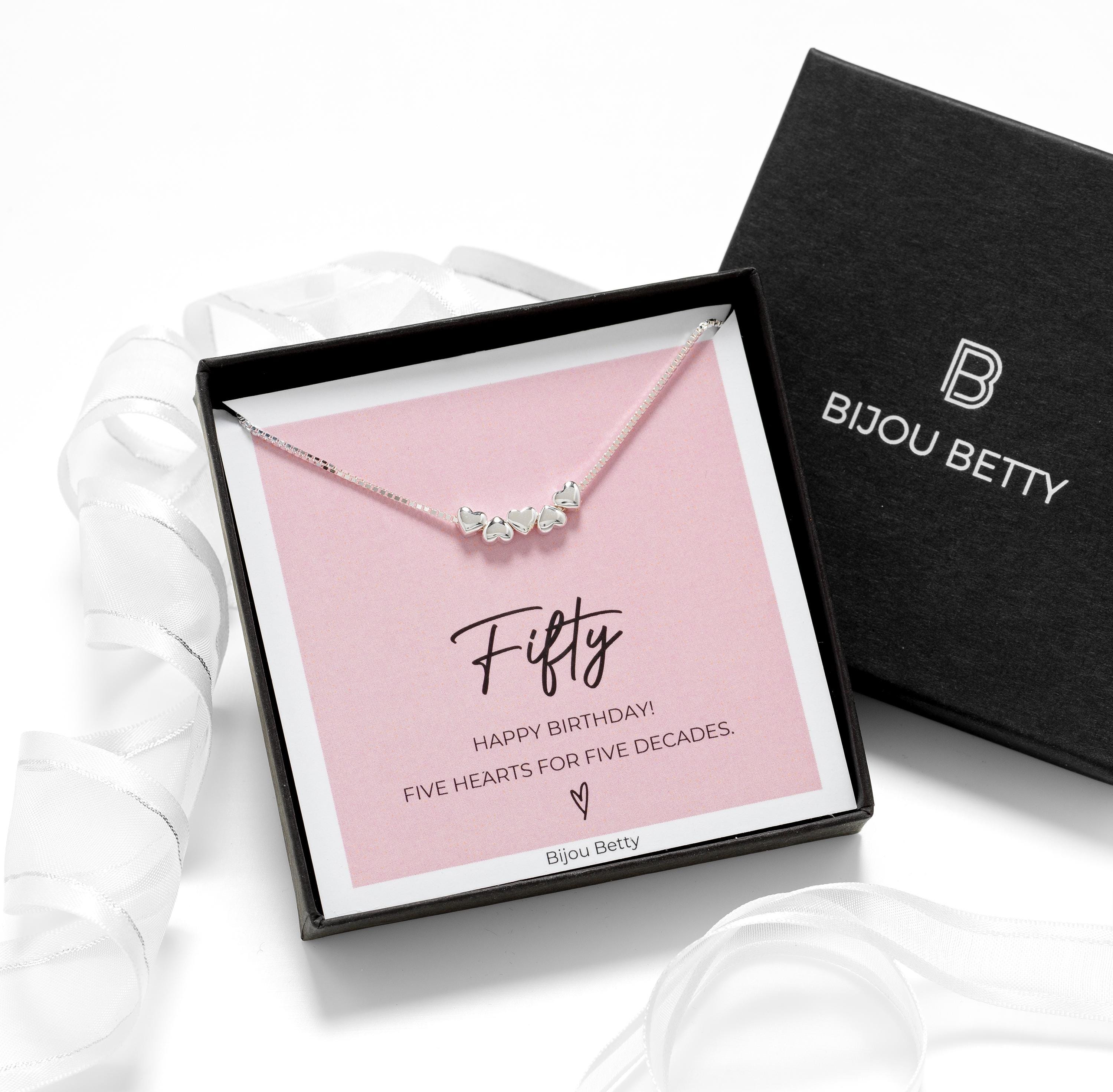 Close-up of 925 silver necklace with five dainty hearts, ideal for 50th birthday gifts for daughters or sisters.