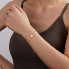 Close-up of gold-plated stainless steel heart bracelet, perfect for colleague&#39;s birthday gift.