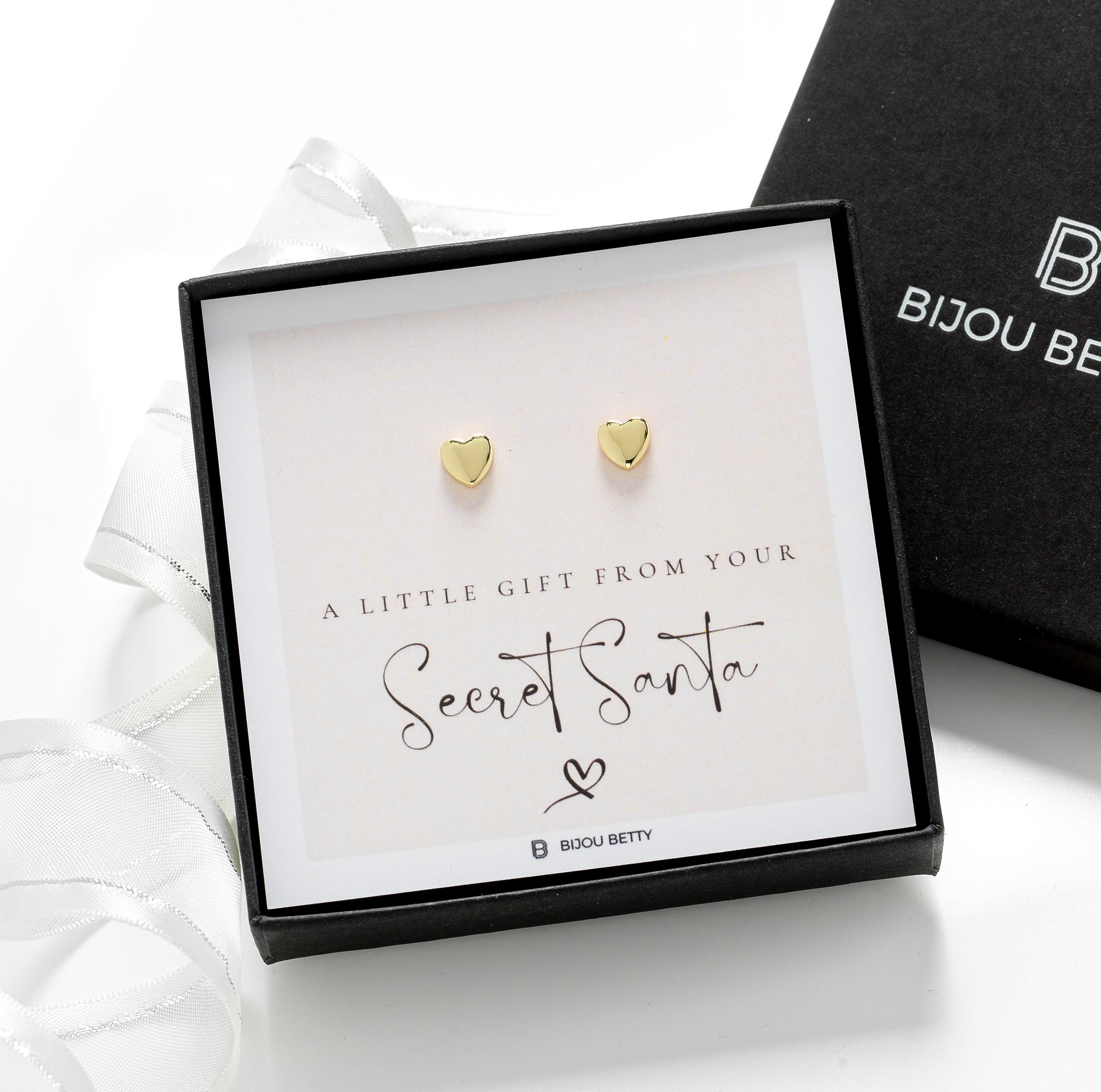 Close-up of 14k gold-plated heart earrings, perfect for Christmas gifts for sisters.