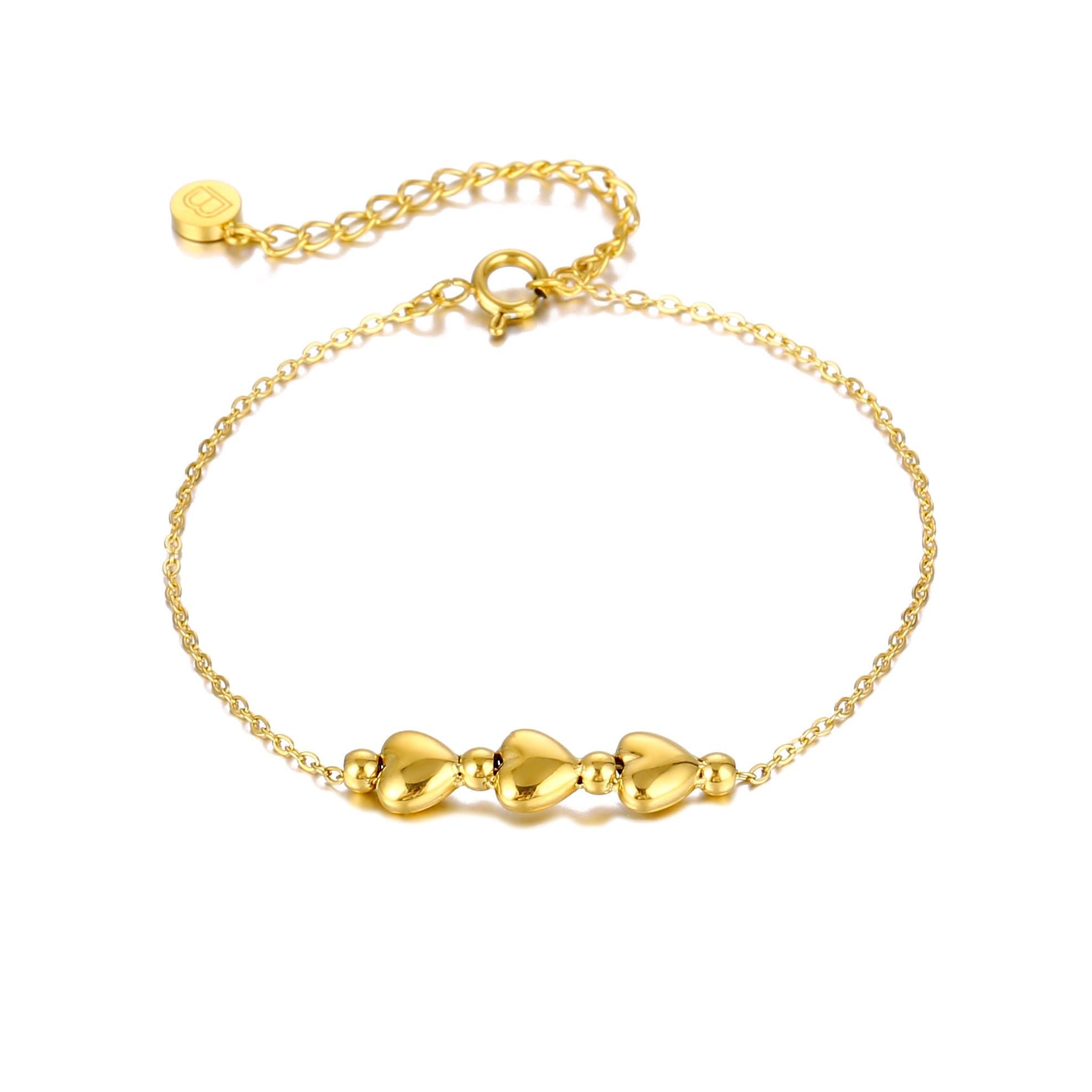 Close-up of gold-plated stainless steel 3 heart bracelet, perfect for a thank you gift or wedding gift for sisters.