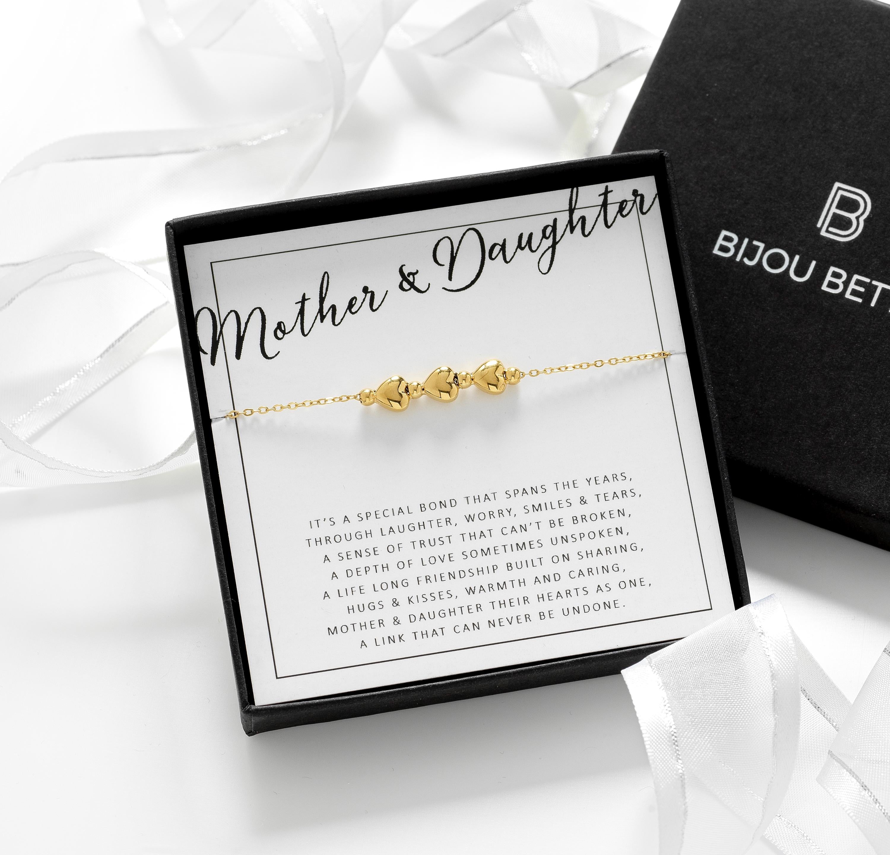 Close-up of gold-plated 3 heart bracelet, perfect for wedding day gifts for mothers or daughters.