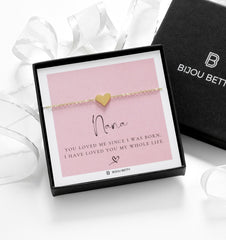 Close-up of gold-plated heart bracelet, perfect for Christmas gifts for grandmothers.