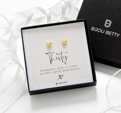 Close-up of gold-plated heart stud earrings, perfect for 30th birthday gifts for daughters.