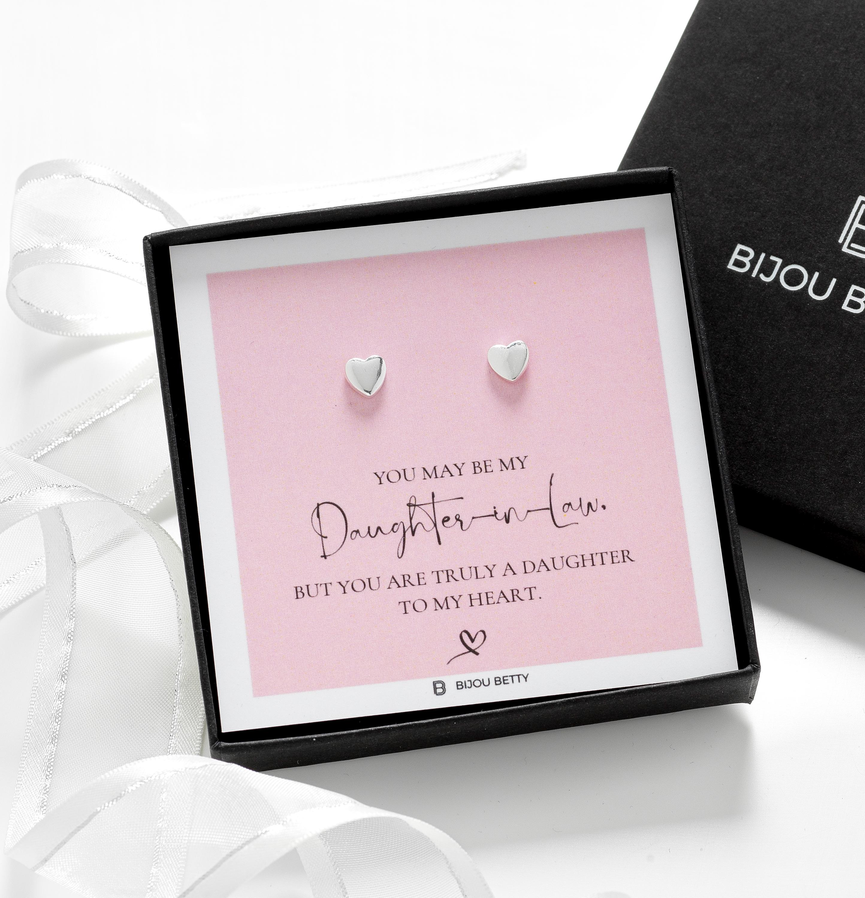 Close-up of 14k gold-plated heart earrings, perfect for daughter-in-law wedding or thank-you gifts.