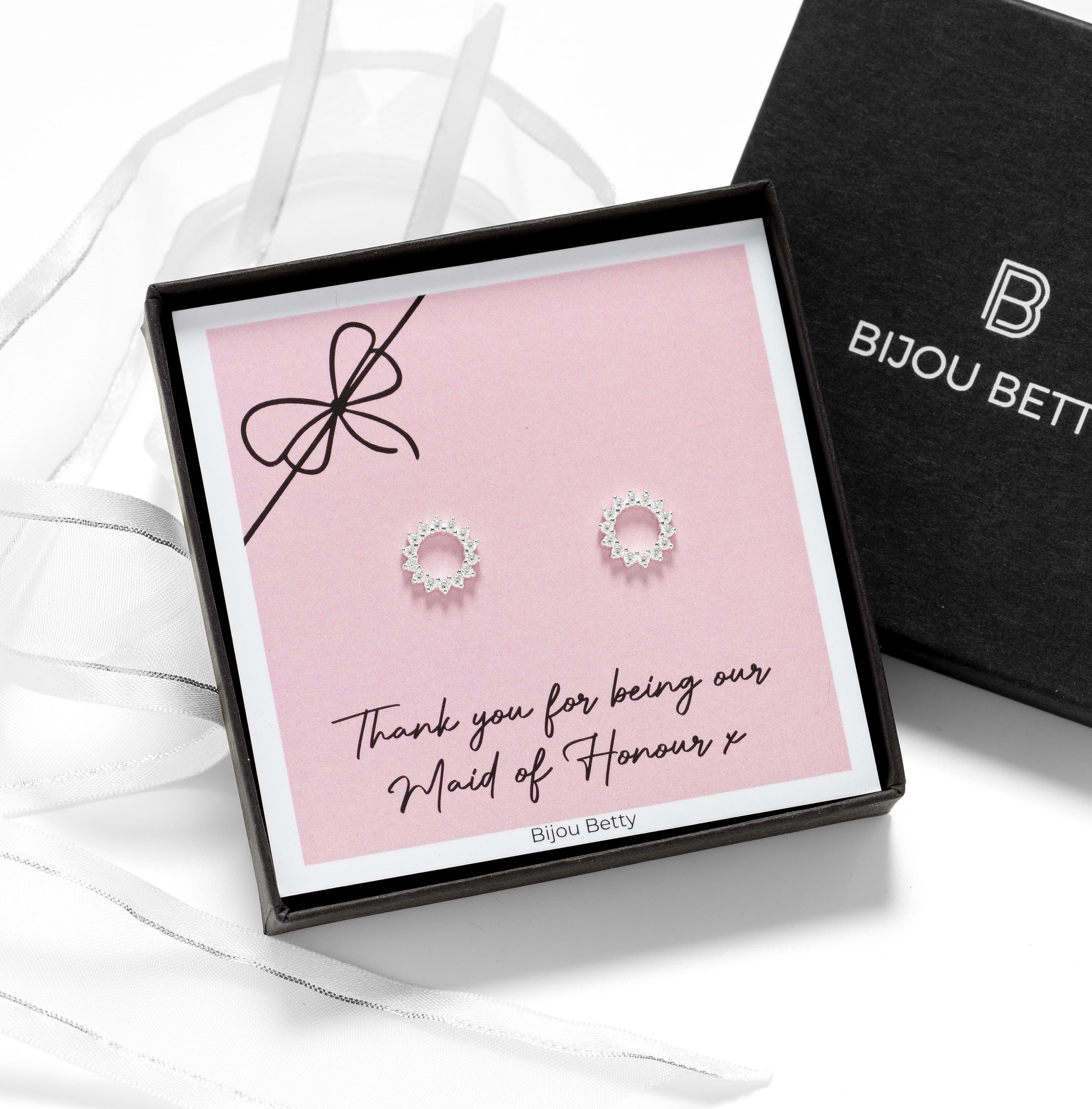 Close-up of 18k gold-plated sunburst earrings, perfect for maid of honour thank-you gifts.