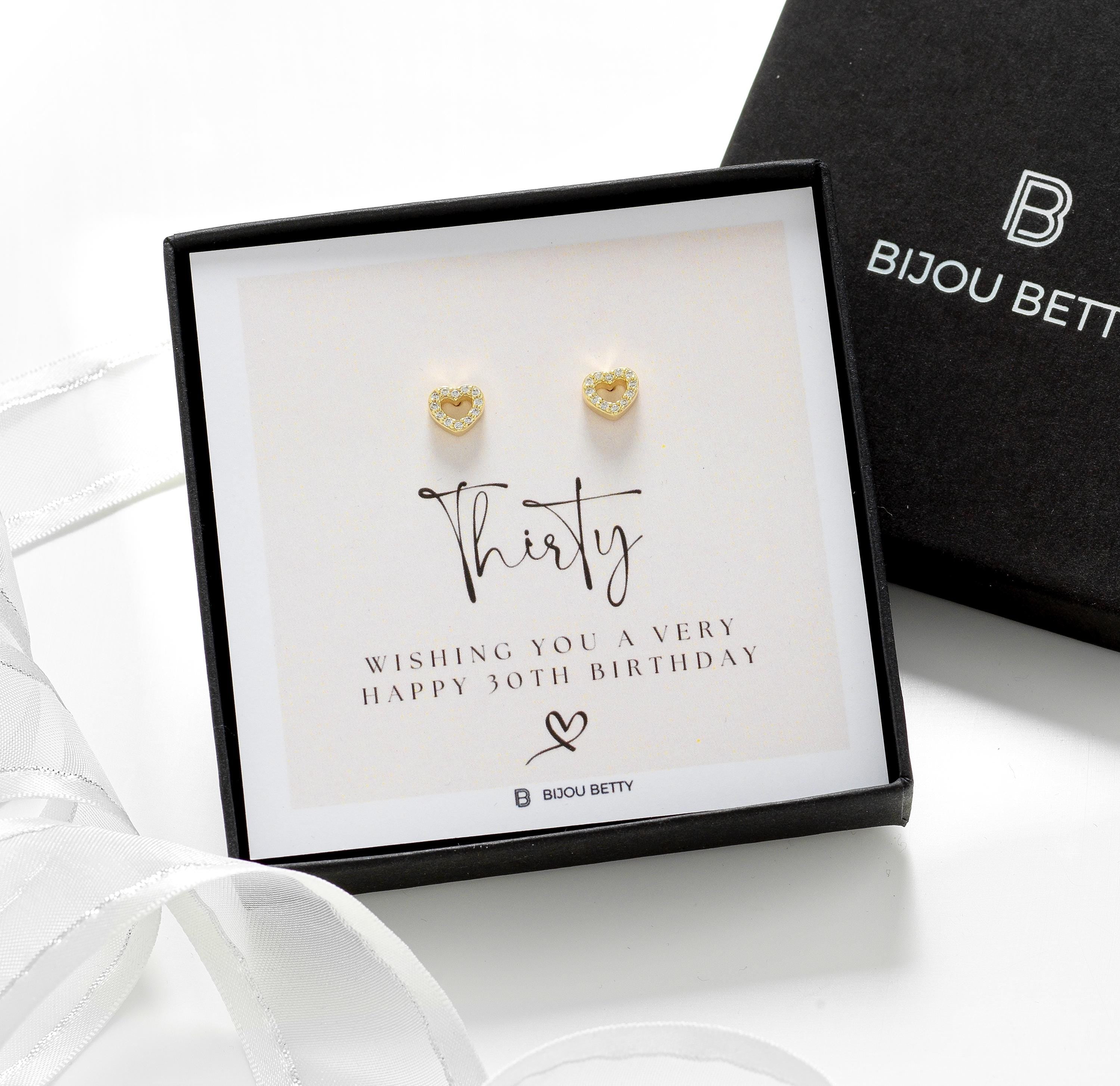 Close-up of rose gold-plated heart earrings, perfect for 30th birthday gifts for sisters.