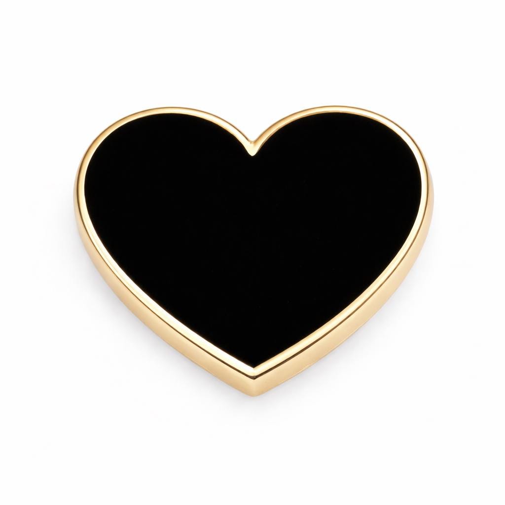 Close-up of 16mm black heart enamel pin, ideal anniversary or Christmas gift for wife