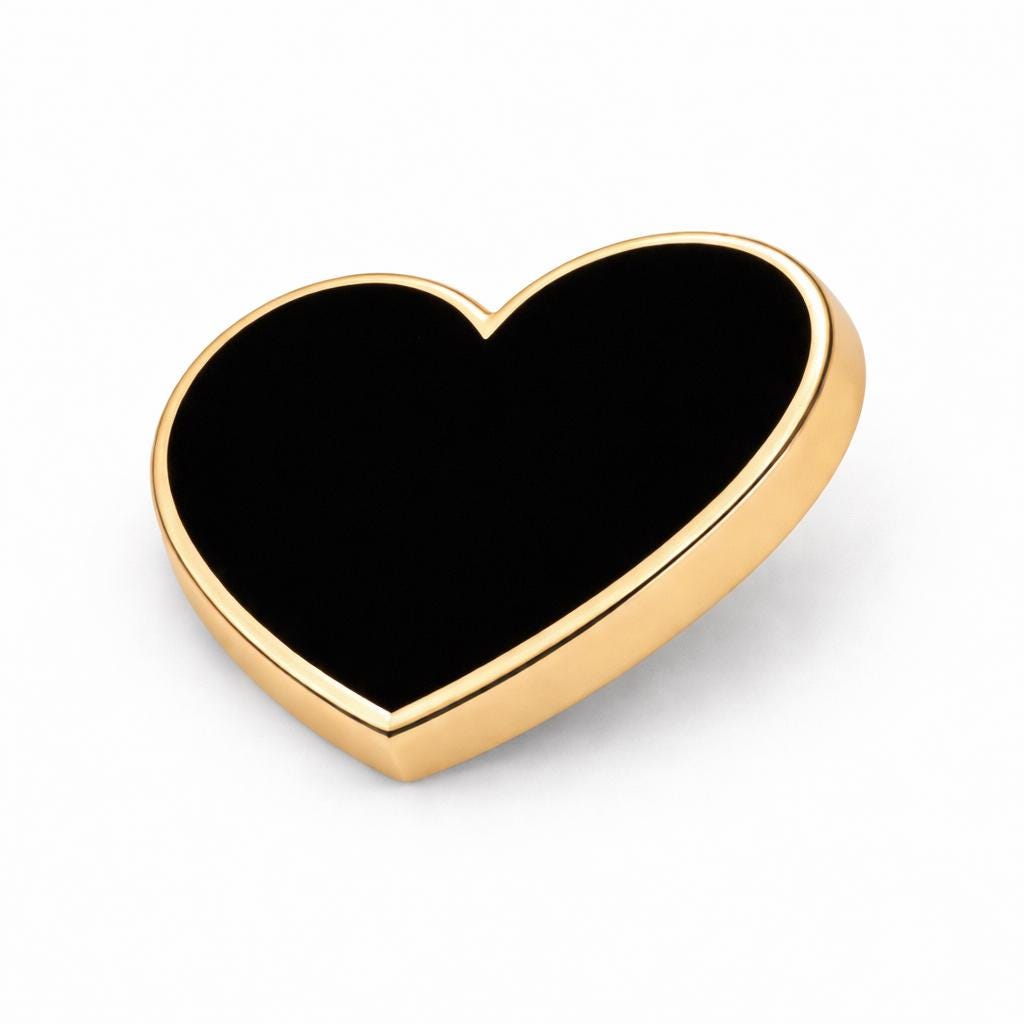 Close-up of 16mm black heart enamel pin, ideal anniversary or Christmas gift for wife
