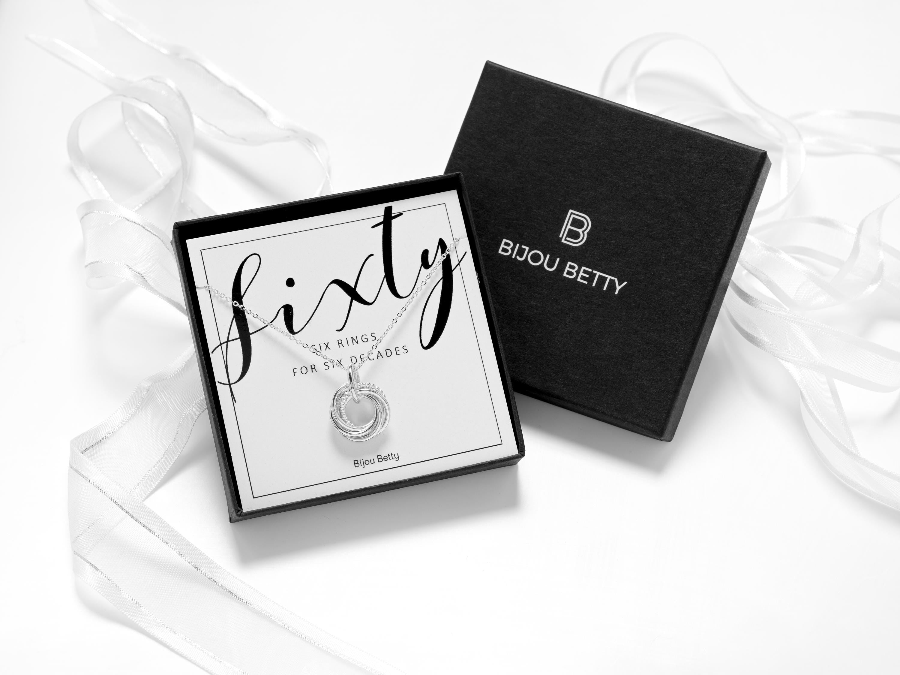 60th birthday silver decades necklace with luxury packaging.