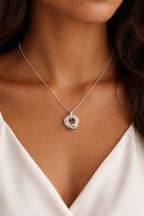 Model wearing 5 ring necklace
