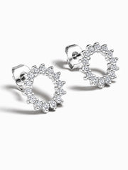 Silver sunburst stud earrings in sterling silver with sparkling white cubic zirconia stones.